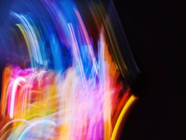 Light painting be creative blurry effect bokeh background on a black