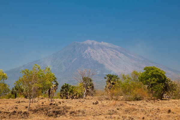 View of the Agung volcano. Mountain landscape in Bali, Indlnesia. Volcano in clear weather during the day.