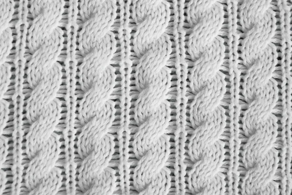 White knitted texture with ornament braids — Stock Photo, Image