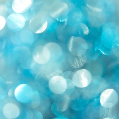 Soyut bokeh arkaplanı. Güzel mavi arka plan. Bulanık parıldayan parıltılar, parıldayan toz makrosu. Yaklaş..