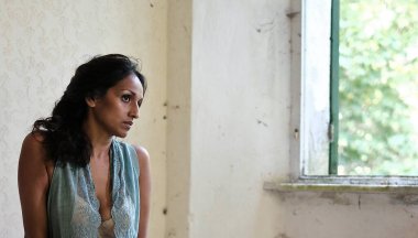 Asian model in lingerie (budoir) during a photo shoot
