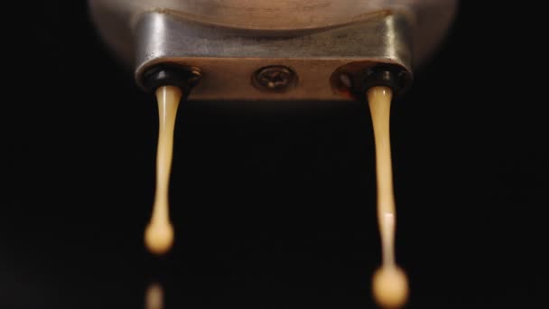 Close up Slow Motion of Espresso Pouring from Coffee Machine. Drinking roasted black coffee. Making espresso Flowing fresh ground coffee. Pouring coffee stream from professional machine in cup — Video
