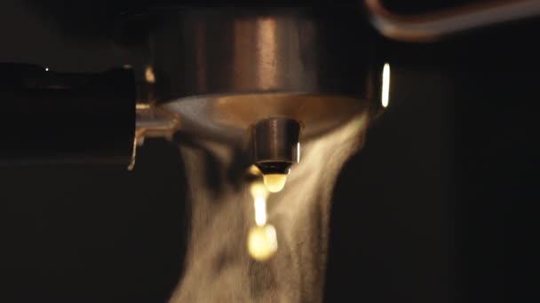 Close up of Pouring coffee stream from professional machine, Crema Espresso from coffee maker machine. Espresso coffee drop from the coffee machine in slow motion — Stockvideo