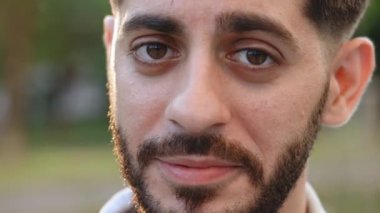 Front close up of caucasian bearded man, young human face with white skin, smile look at camera open and confident. Guy wide smiling with healthy white teeth. Portrait of caucasian european male