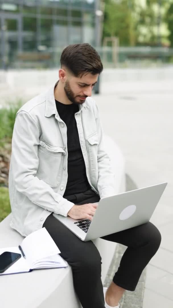 Vertical Video Appealing Armenian Bearded Man Typing Laptop Keyboard While — Stockvideo