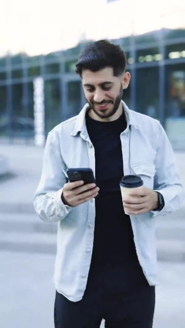 Portrait Mode Smiling Young Attractive Bearded Man Walking Use Smartphone — Video Stock