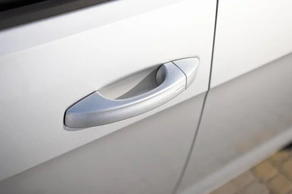 Keyless entry car door handle with keyless go touch sensor. Car door handle. Access button. Automatic opening of a car door without a key. Exterior design of a new electric luxury car.