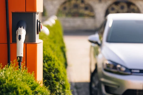 Electric charging station for charging cars. Charge station for electric cars. Electric car charger on street.