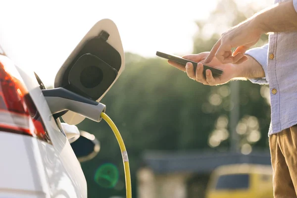 Businessman Charging Electric Car Outdoor Charging Station Unrecognizable Man Plugging — Stockfoto