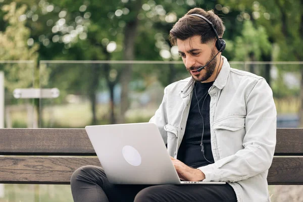 Young Caucasian Business Man Wearing Headphones Communicating Video Call Ethnic — Stock Photo, Image