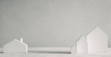 Gri arka planda beyaz ahşap oyuncak evler. Minimalist İskandinav dekoratif tasarımı