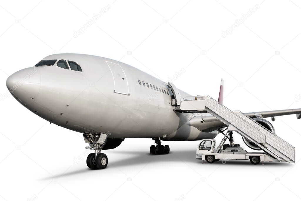 Wide body passenger airplane with boarding ramp isolated on white background