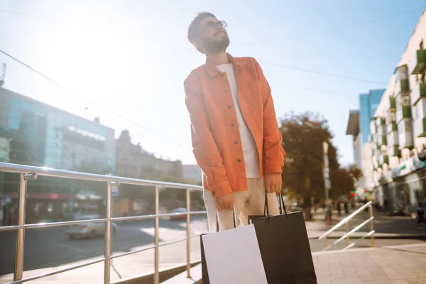 Smiling Man Shopping Bags Walking Street Purchases Black Friday Discounts — Stockfoto