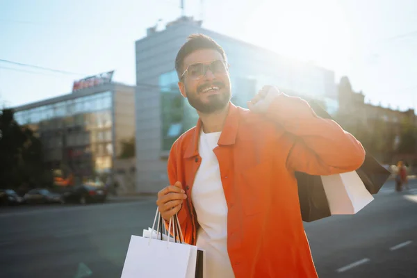 Smiling Man Shopping Bags Walking Street Purchases Black Friday Discounts — Fotografia de Stock