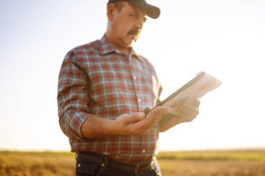 Farmer is checking soil quality before sowing. Agriculture, gardening or ecology concept.