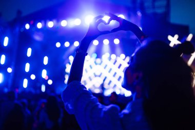 rowd with raised hands at music festival. Summer holiday, vacation concept.