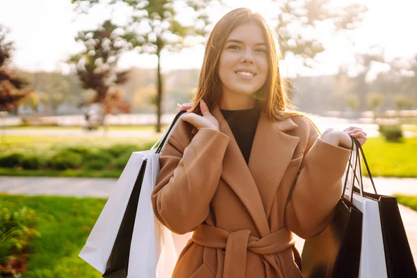 Smiling Woman Shopping Bags Walking Street Purchases Black Friday Discounts — 스톡 사진