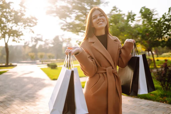 Smiling Woman Shopping Bags Walking Street Purchases Black Friday Discounts — 图库照片