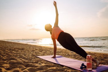 Sport woman doing exercises outdoors. Young woman doing stretching. Sport, Active life, sports training, healthy lifestyle.