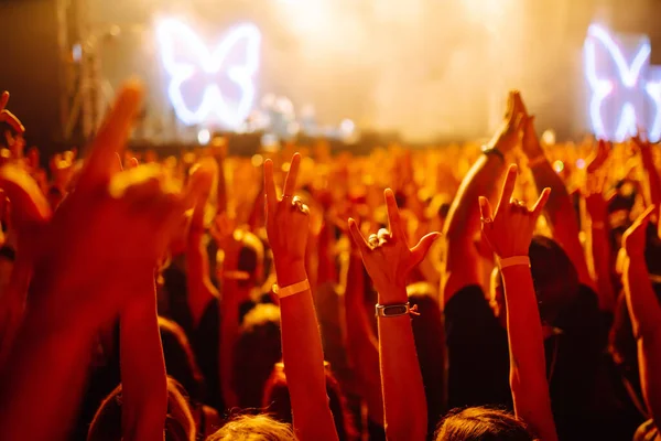 rowd with raised hands at music festival.  Youth, party, vacation concept.