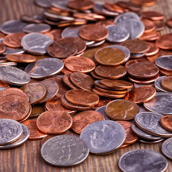 Pile of Golden coin, silver coin, copper coin, quarters, nickels, dimes, pennies, fifty cent piece and dollar coins. Various USA coins, American coins for business, money, financial coins and economy