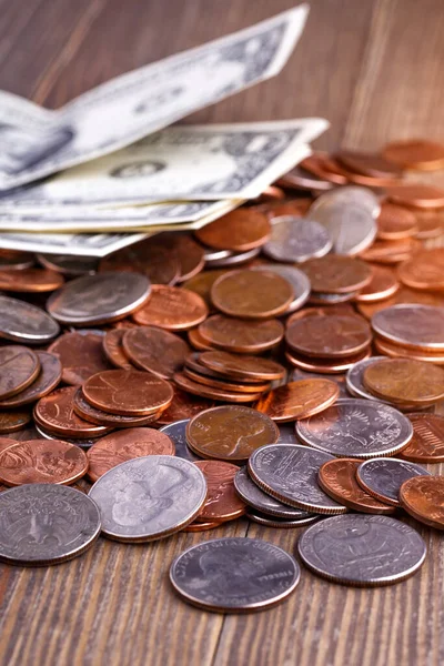 Pile of Golden coin, silver coin, copper coin, quarters, nickels, dimes, pennies, fifty cent piece and dollar coins. Various USA coins, American coins for business, money, financial coins and economy