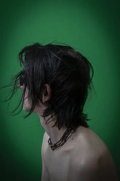 Portrait Man Black Hair Sitting Dark Green Wall — Photo