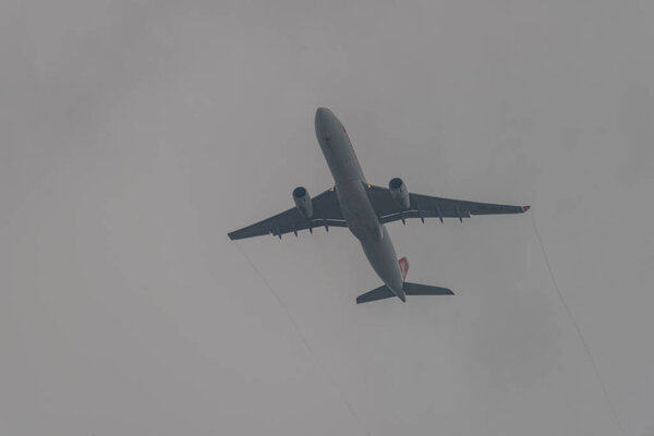 Takeoff of airplanes in Zuich airport in spring 2022 04 03 in cloudy evening