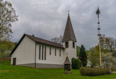 Cloudy dark evening in spring time in Buchenau village in Germany