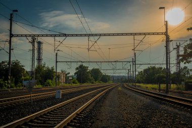 Railway yard in Prague Holesovice station in summer cloudy color evening