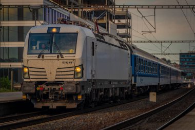 Passenger trains near station Prague Holesovice in capital of Czech republic in summer evening