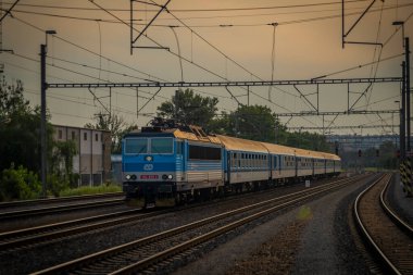 Passenger trains near station Prague Holesovice in capital of Czech republic in summer evening