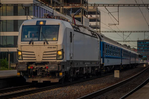 Passenger trains near station Prague Holesovice in capital of Czech republic in summer evening