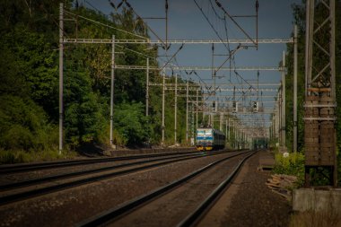 Trains on main czech railway Prague Kolin in summer hot sunny evening