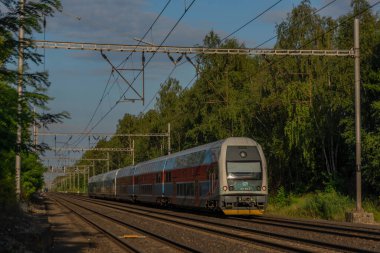 Trains on main czech railway Prague Kolin in summer hot sunny evening