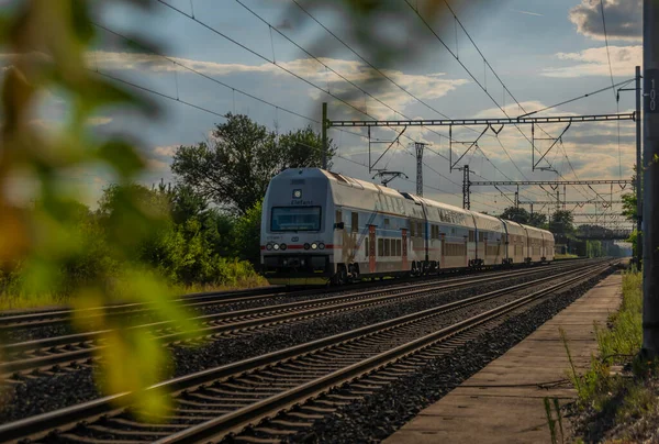 Trains on main czech railway Prague Kolin in summer hot sunny evening