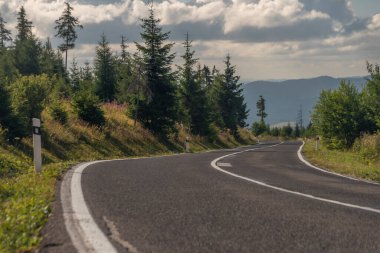 Road in Vysoke Tatry mountains in summer hot sunny fresh day