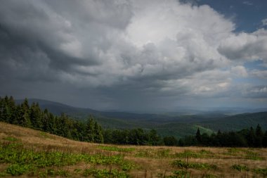Summer stormy cloudy day in Zywiecki park Krajobrazowy with colorfull fresh view