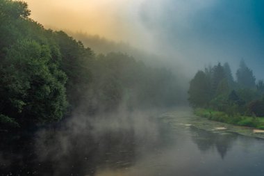 Vyssi Brod town in summer foggy morning with color buildings and fresh nature