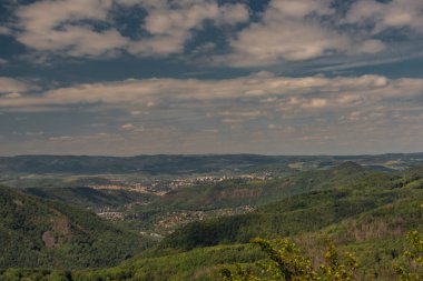 View from Varhost hill and lookout tower there for Ceske Stredohori mountains in summer