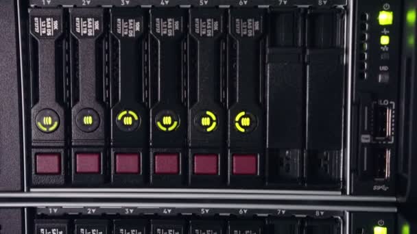 Close up shot of data servers with ethernet cables and blinking hard drive lights — Stock Video