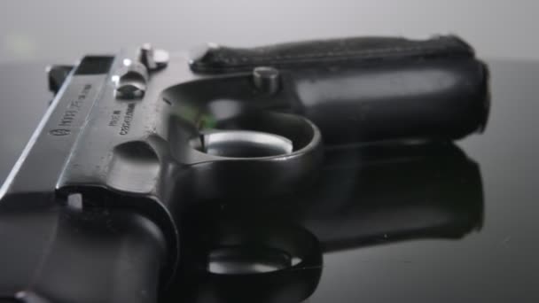 9Mm Gun Rotating Reflective Surface — Vídeo de Stock