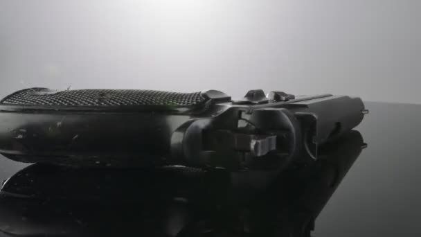 9Mm Gun Rotating Reflective Surface — Stock Video