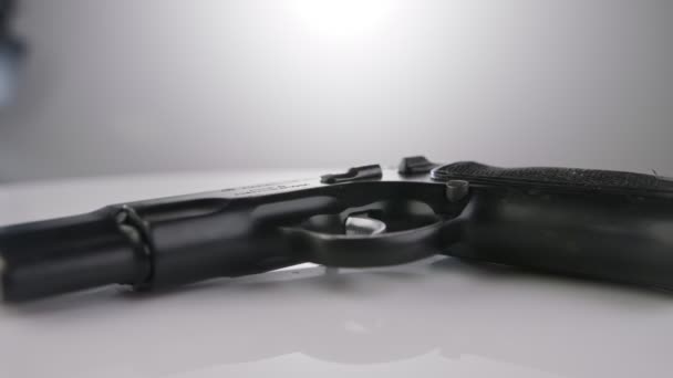9Mm Gun Rotating Reflective Surface — Stockvideo