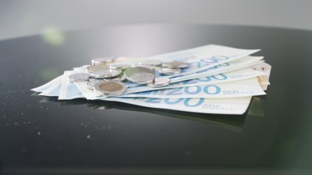 Bills Coins New Israeli Shekels Rotating Reflective Surface — Stockvideo