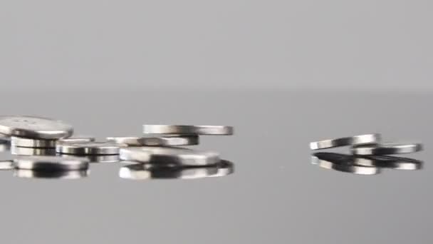 New Israeli Shekels Coins Falling Reflective Surface — Stockvideo