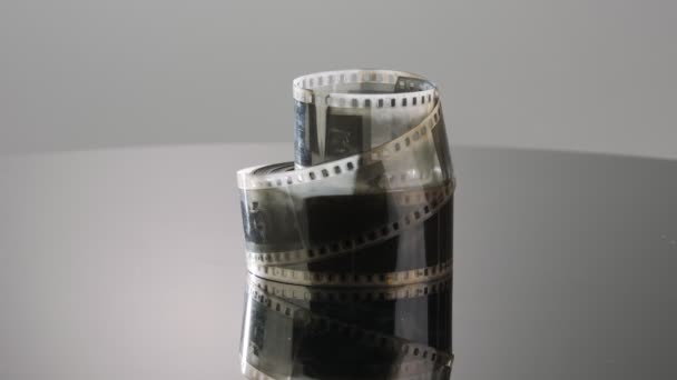 35Mm Film Negative Rotating Reflective Surface — Video Stock