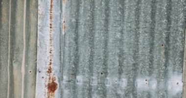 Abstract textures and patterns - metal wall panels with rust and corrosion