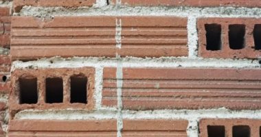 Abstract patterns ans textures - old cracked red bricks wall