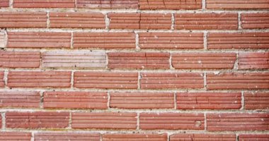 Abstract patterns ans textures - old cracked red bricks wall